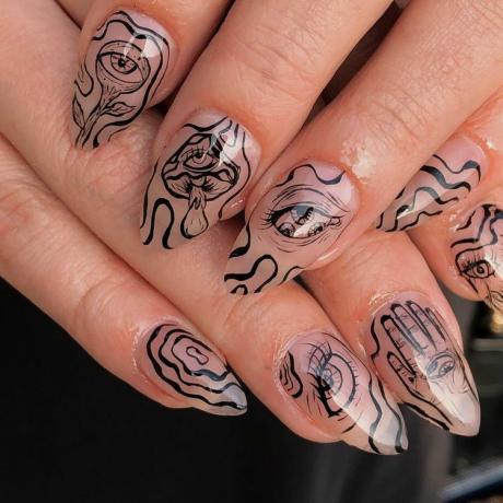 Heldere nagels met zwarte kronkelige ooglijnen en handontwerpen